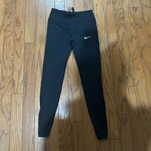 Nike leggings with drawstrings and mesh lining on the lower back legs size XS